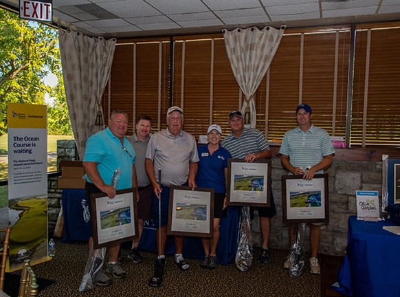 Jeffrey A. Taylor and his team taking 1st place at the Liberty Mutual Habitat for Humanity Golf Tournament